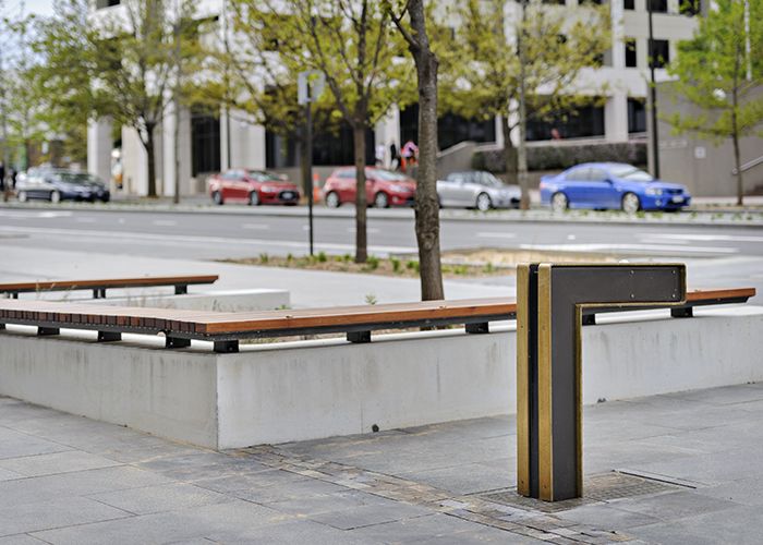 Custom drinking fountain and benches with brass detailing. Randal Photography.