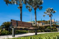 Aria Seat (CMA1) 3-seater with battens in aluminium woodgrain Spotted Gum, Textura Woodland Grey frame.