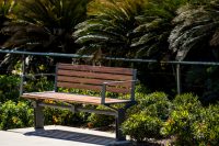 Aria Seat (CMA1) 3-seater with battens in aluminium woodgrain Spotted Gum, Textura Woodland Grey frame.