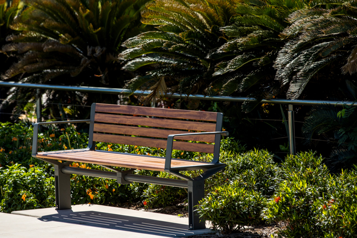 Aria Seat (CMA1) 3-seater with battens in aluminium woodgrain Spotted Gum, Textura Woodland Grey frame.