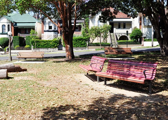 New brightly coloured seats and pre-existing hardwood seats harmoniously blend together