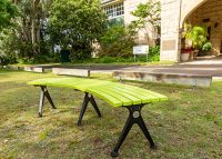 Mall Curved Slim Bench, powdercoated in Lycra Strip green with Night Sky frames.