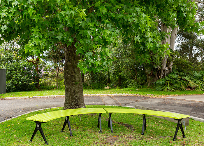 Mall Curved Slim Bench, powdercoated in Lycra Strip green with Night Sky frames.