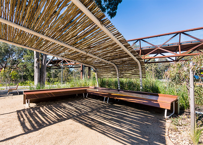 Custom benches, designed by SBLA, with hardwood battens and custom Shoji White frame.