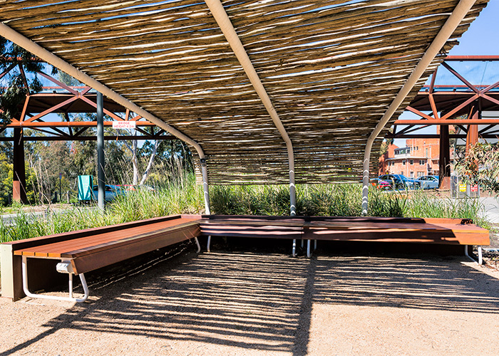 Custom benches, designed by SBLA, with hardwood battens and custom Shoji White frame.