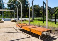 Custom bench, designed by SBLA, with hardwood battens and custom Shoji White frame.