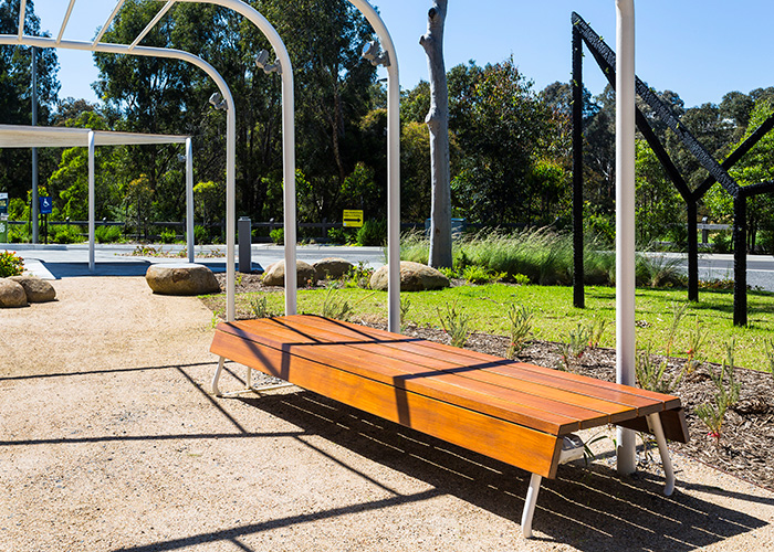 Custom bench, designed by SBLA, with hardwood battens and custom Shoji White frame.
