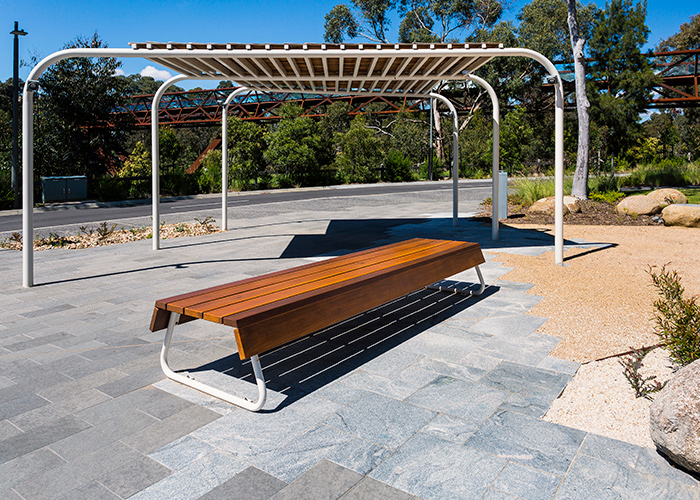 Custom bench, designed by SBLA, with hardwood battens and custom Shoji White frame.