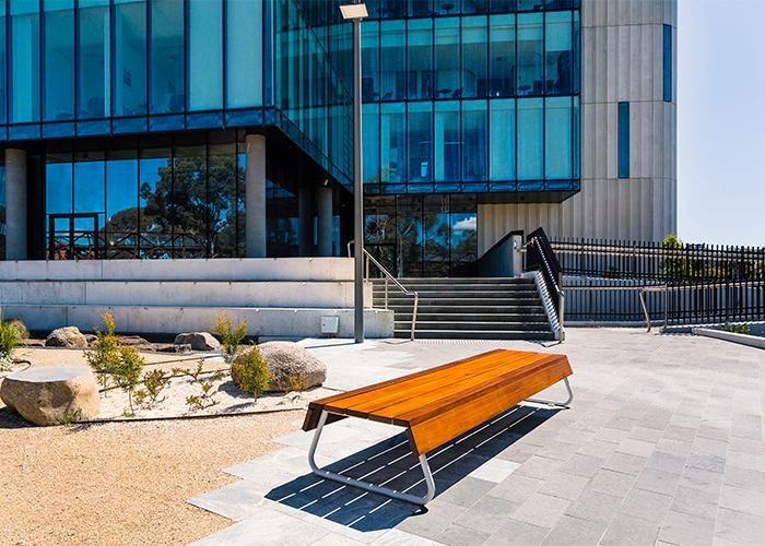 Custom bench, designed by SBLA, with hardwood battens and custom Shoji White frame.