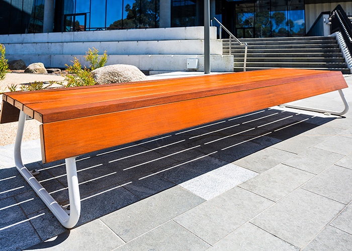 Custom bench, designed by SBLA, with hardwood battens and custom Shoji White frame.