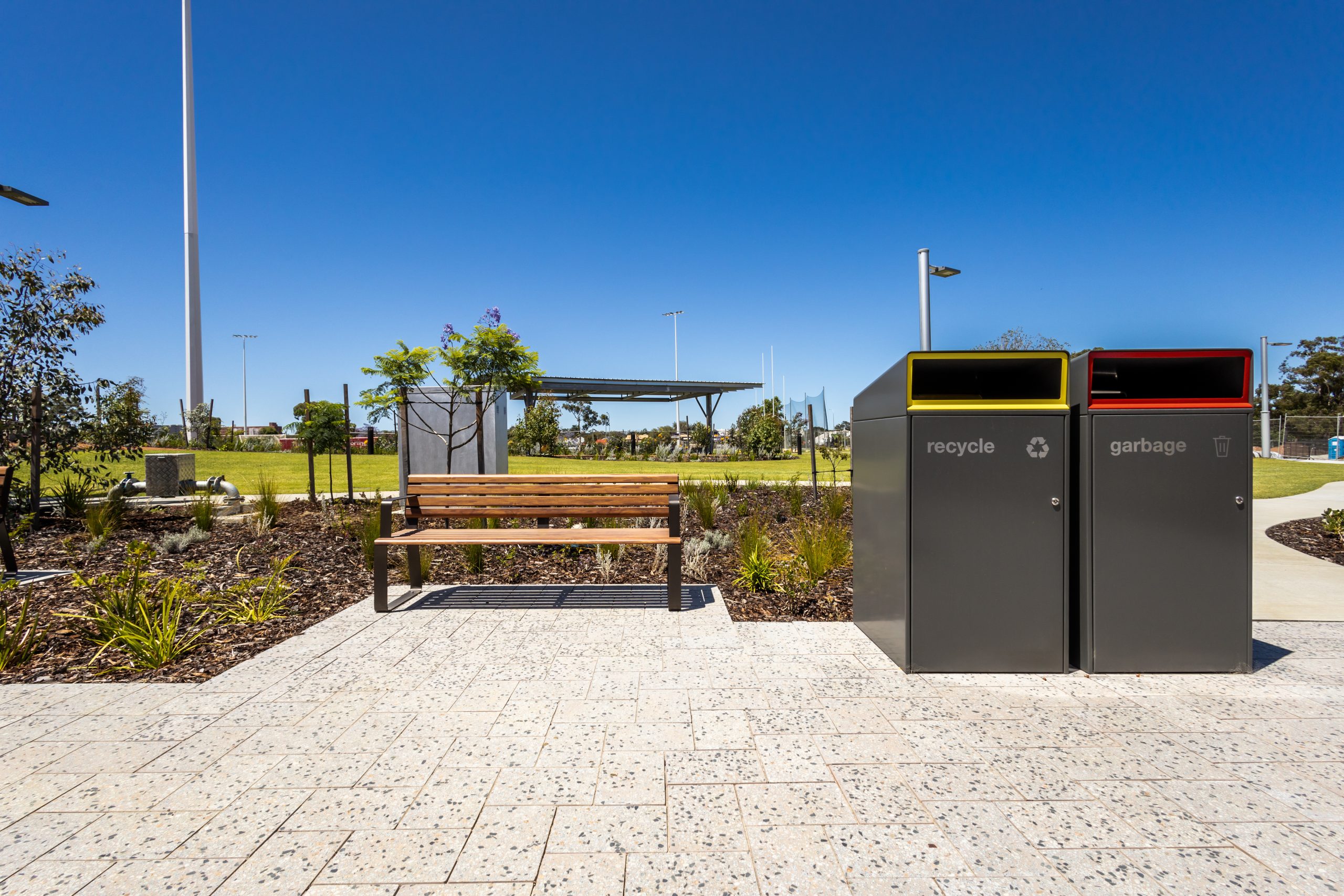 Escola Bin Enclosure (WBE-E240) in Woodland Grey, etched signage, Rectangle insert in Brilliant Yellow and Lobster Red.