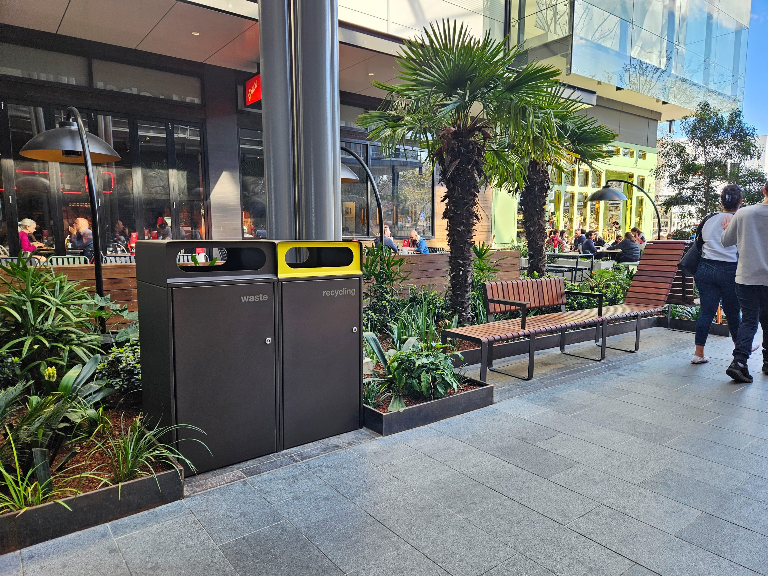 Escola Bin Enclosure (WBE-E120) dual unit in Textura Dark bronze with etched signage, Brilliant Yellow insert.