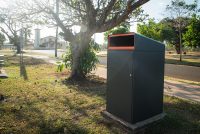 Escola Bin Enclosure (WBE-E240, 240L), powder coated in Textura Monument with Sensation Orange insert.