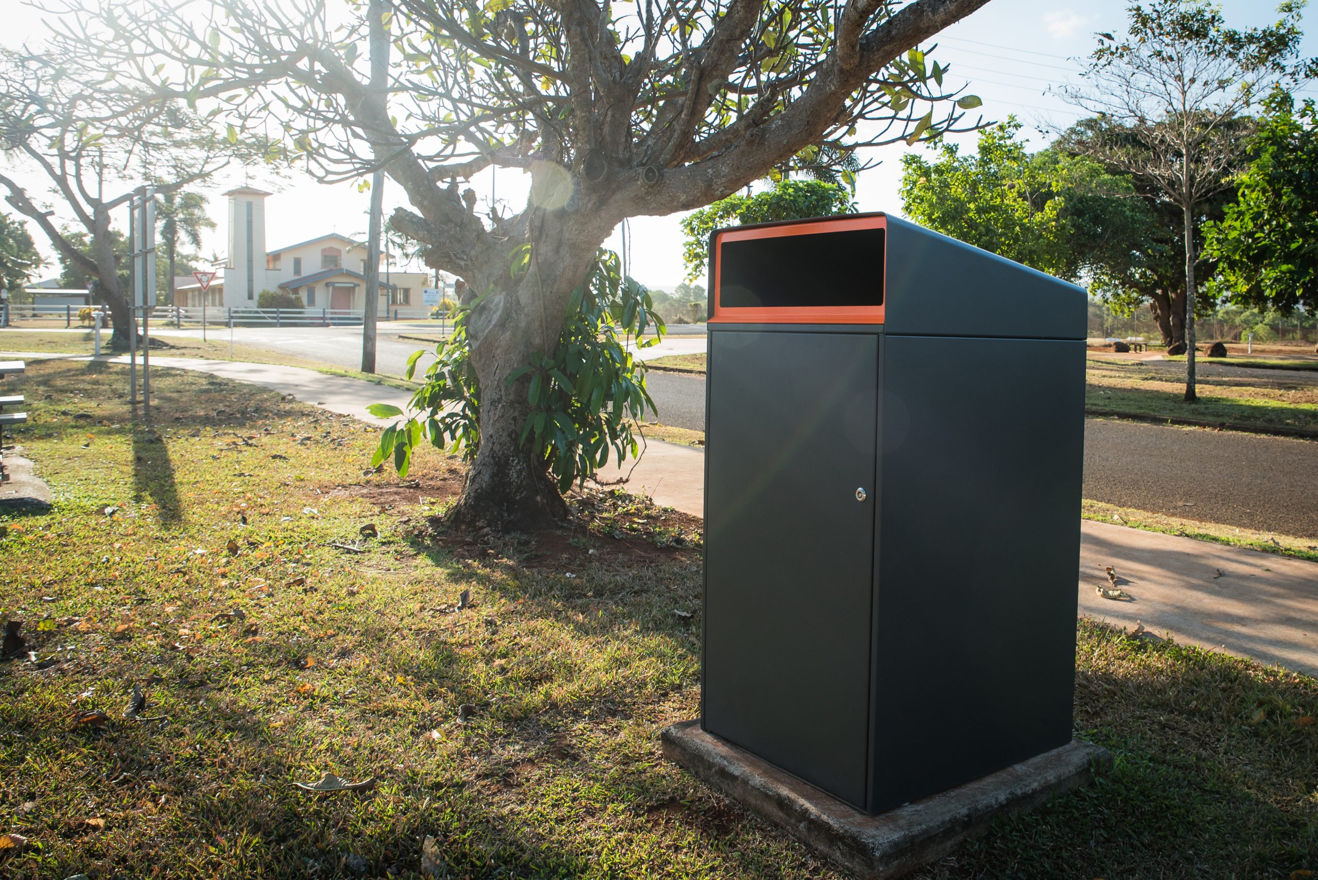 Escola Bin Enclosure (WBE-E240, 240L), powder coated in Textura Monument with Sensation Orange insert.