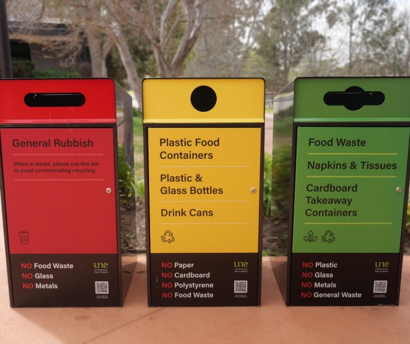 Escola Bin Enclosure (WBE-E240), tailored signage in Lobster Red, Viper Green, Brilliant Yellow. Charcoal body.