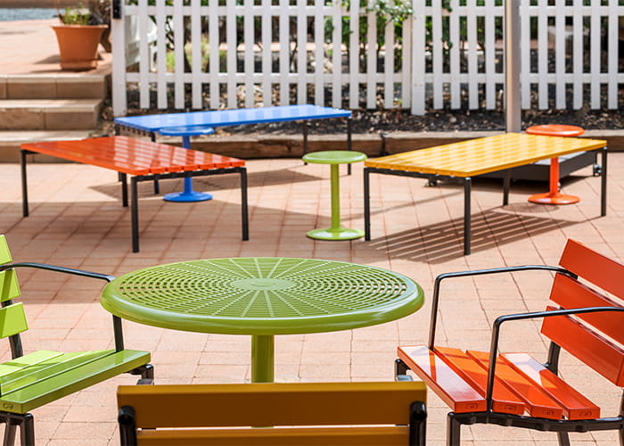 Cafe Round Table and Forum Seats in Lycra Strip, Sunshine, Sensation Orange and Bondi Blue.