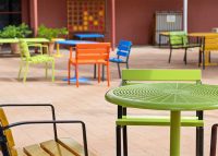 Cafe Round Table and Forum Seats in Lycra Strip, Sunshine, Sensation Orange and Bondi Blue.
