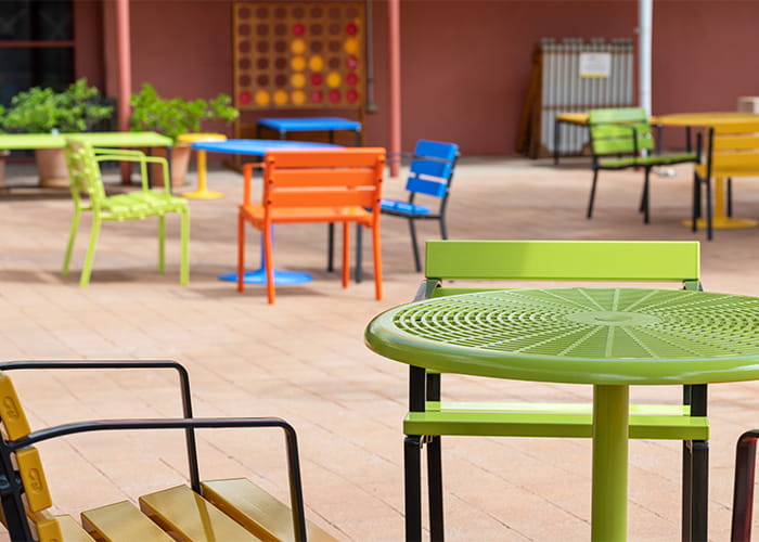 Cafe Round Table and Forum Seats in Lycra Strip, Sunshine, Sensation Orange and Bondi Blue.