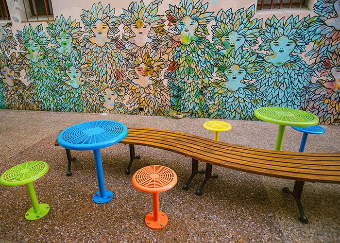 Mall Curved Slim Bench (CMM8-C) with aluminium Spotted Gum battens, Textura Monument frame. With Cafe Macchiato Table and Stool in Brilliant Yellow, Bondi Blue, Sensation Orange and Lycra Strip Green.