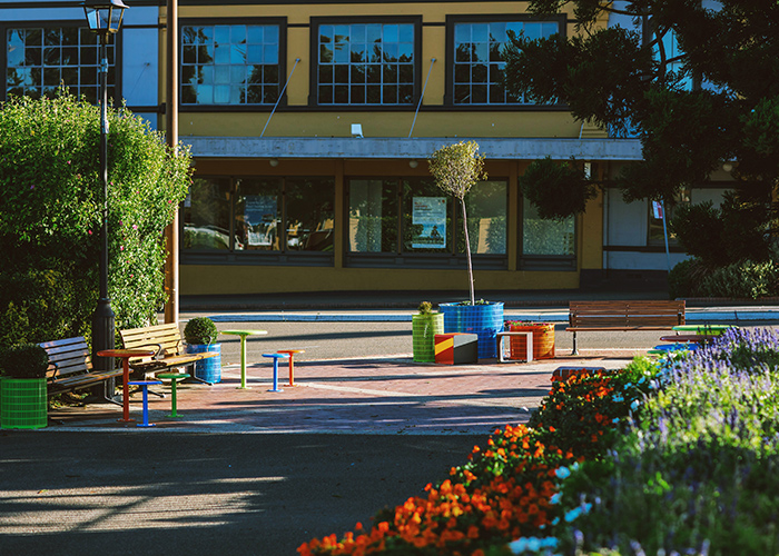 Mall Seat (CMM1, 1750mm) with aluminium Spotted Gum battens, Textura Monument frame. With Cafe Macchiato Tables and Stools, Linea Cubes and Frame Planters.