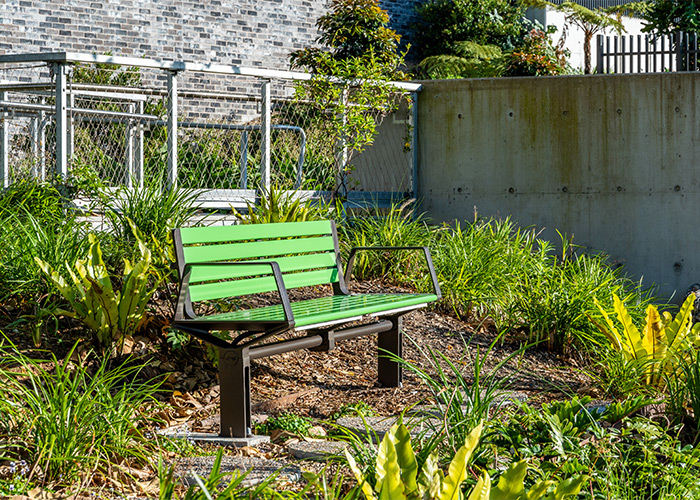 Aria Seat (CMA1, 1800mm) with Viper Green battens, Textura Dark Bronze frame.