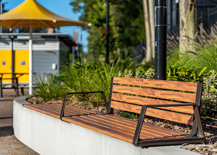 Aria Seating System (3S-3B) with aluminium Spotted Gum battens, Textura Dark Bronze frame.