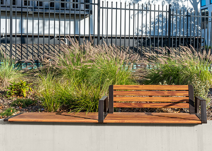 Aria Seating System (3S-3B) with aluminium Spotted Gum battens, Textura Dark Bronze frame.