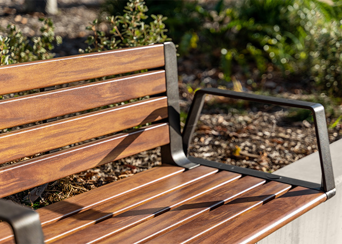 Aria Seating System (3S-3B) with aluminium Spotted Gum battens, Textura Dark Bronze frame.