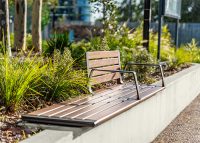 Aria Seating System (3S-3B) with aluminium Spotted Gum battens, Textura Dark Bronze frame.