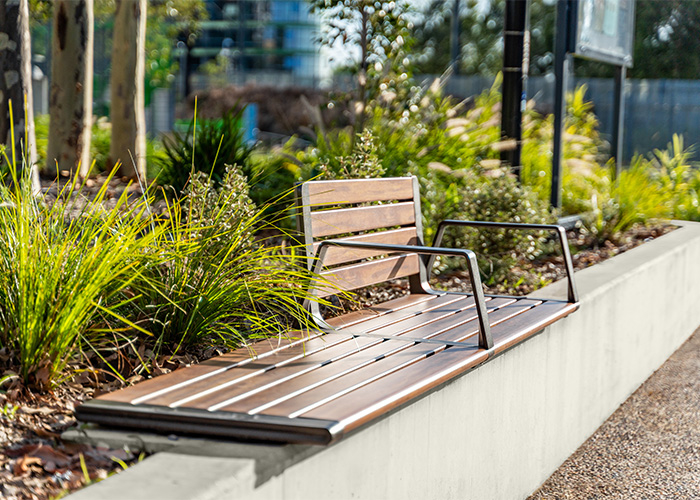 Aria Seating System (3S-3B) with aluminium Spotted Gum battens, Textura Dark Bronze frame.
