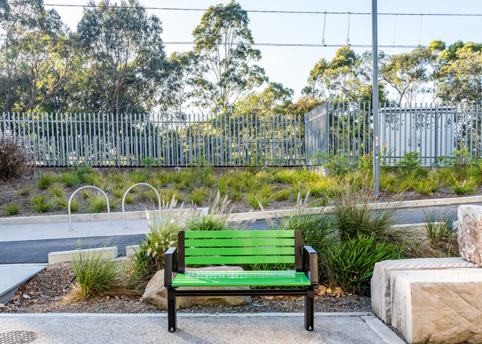 Aria Seat (CMA1, 1200mm) with Viper Green battens, Textura Dark Bronze frame.