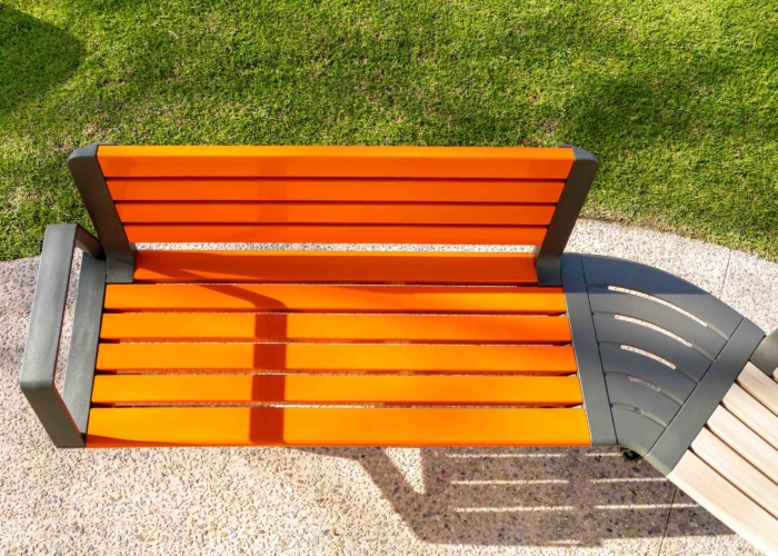 Aria Seating System in Sensation Orange, aluminium Curly Birch and Textura Woodland Grey.