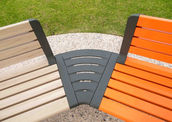 Aria Seating System in aluminium Curly Birch, Sensation Orange and Textura Woodland Grey.