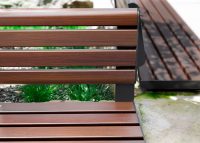 Linea Seat (LIS10, 1500mm) plinth-fixed with aluminium woodgrain Bush Cherry battens, Monument frame.