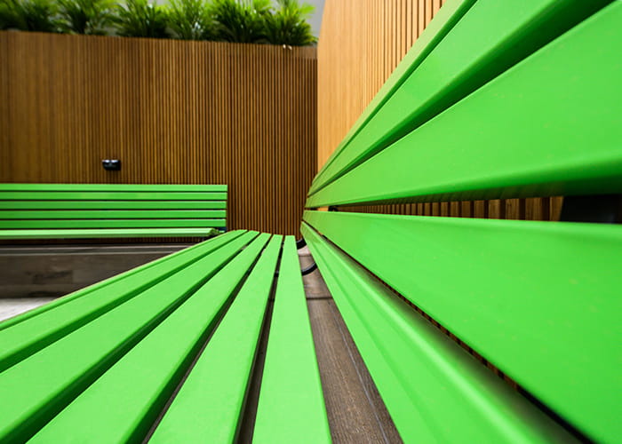 Plinth-mounted Mall Seat, in Viper Green.