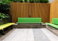 Plinth-mounted Mall Seat, in Viper Green, and Mall Mitred Slim Bench, in Brilliant Yellow and Lycra Strip.