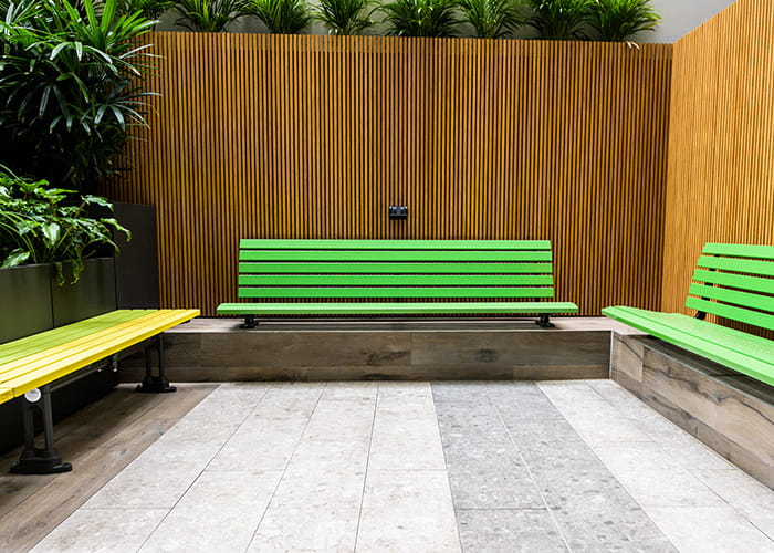 Plinth-mounted Mall Seat, in Viper Green, and Mall Mitred Slim Bench, in Brilliant Yellow and Lycra Strip.
