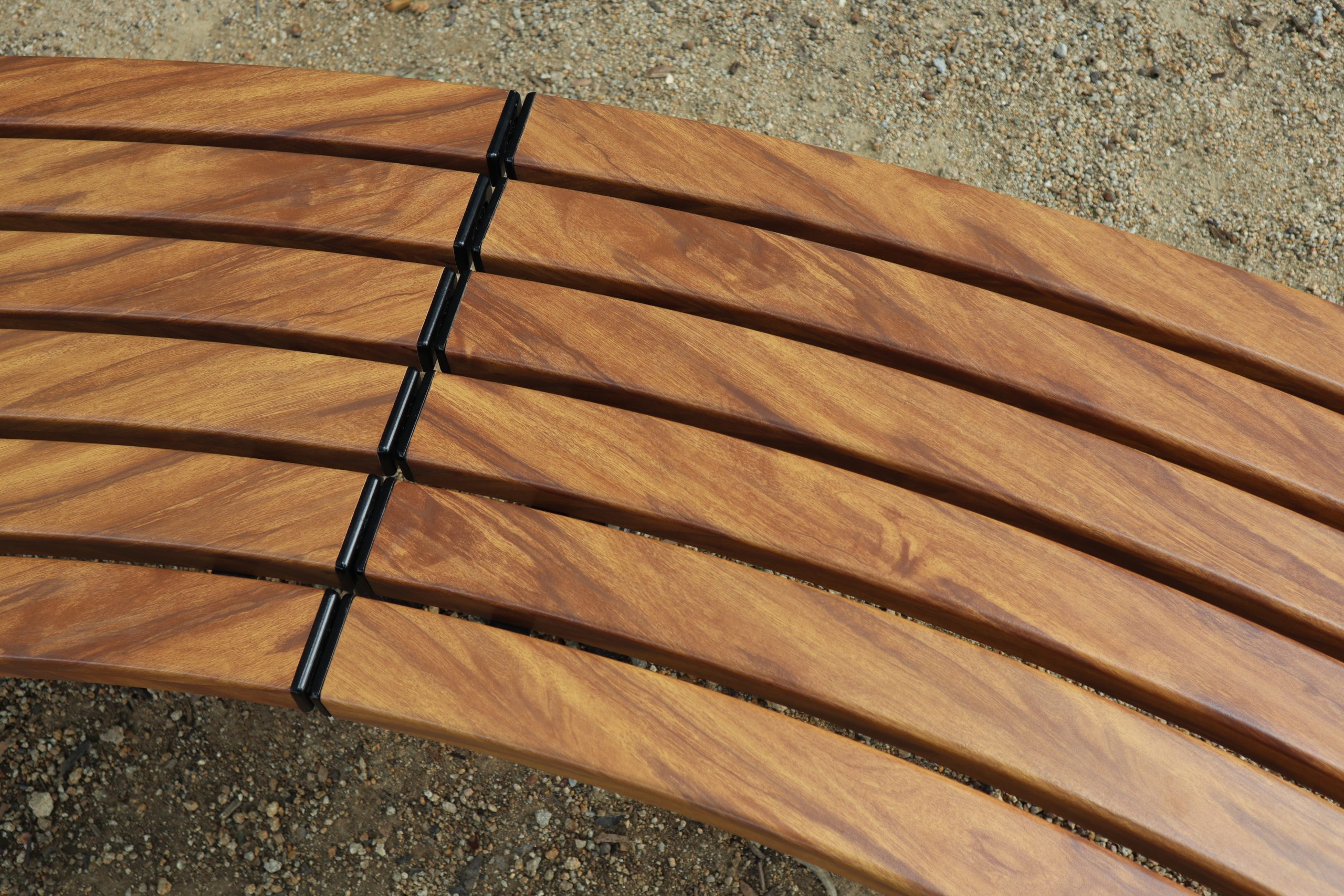 Mall Curved Benches, battens in aluminium woodgrain Spotted Gum, frames in Night Sky.