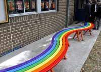 Mall Curved Slim Benches with rainbow battens, Sensation Orange frame.
