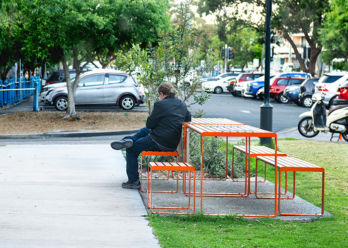 Linea Table (LIT10) with Linea Benches (LIB6) in aluminium Spotted Gum and Sensation Orange.