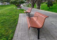 Classic Plaza Seat with custom armrest.