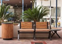 Aria Seat and Simple Bin, woodgrain aluminium battens in Spotted Gum, frame in Textura Monument.