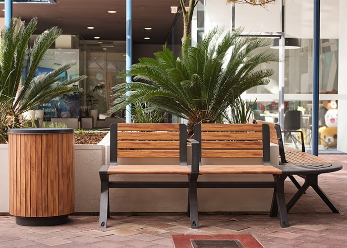 Aria Seat and Simple Bin, woodgrain aluminium battens in Spotted Gum, frame in Textura Monument.