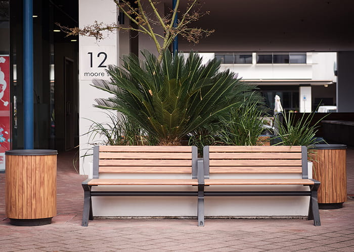 Aria Seat and Simple Bin, woodgrain aluminium battens in Spotted Gum, frame in Textura Monument.