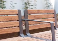 Aria Seat, woodgrain aluminium battens in Spotted Gum, frame in Textura Monument.