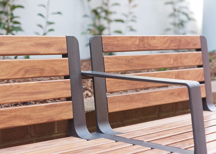 Aria Seat, woodgrain aluminium battens in Spotted Gum, frame in Textura Monument.