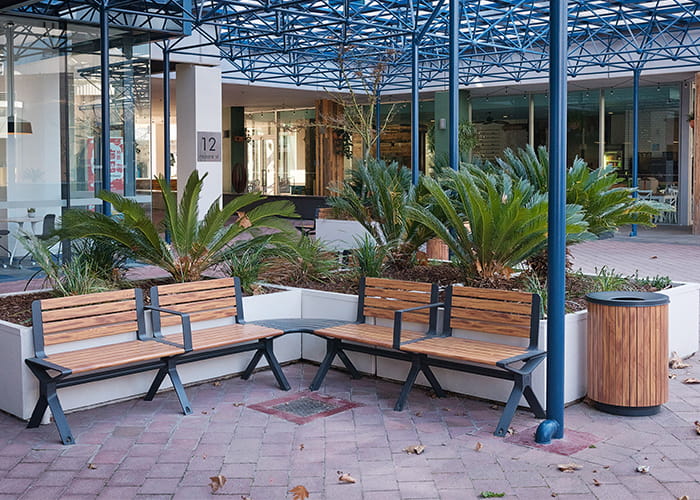 Aria Seat and Simple Bin, woodgrain aluminium battens in Spotted Gum, frame in Textura Monument.