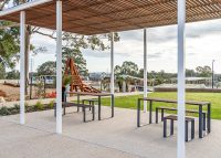 Linea Setting with Table (LIT10-DDA, 1800mm) and Benches (LIB6) with hardwood battens, Ironstone frame.