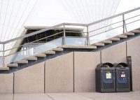 Pairs of recycling and garbage Monsoon Enclosures are set at strategic positions.