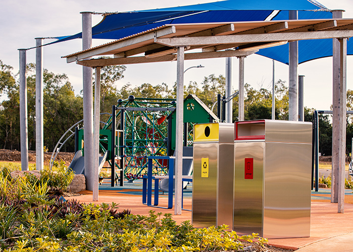 Escola Bin Enclosure (WBE-E120) in stainless steel, Circle insert in Brilliant Yellow, Rectangle in Lobster Red.